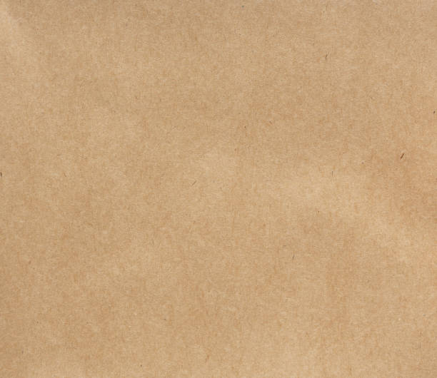 istock Detailed textured smooth brown kraft paper background. 1164195971