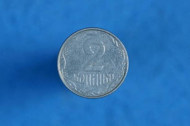 istock white Ukrainian coin two pennies on a blue background 1164196105