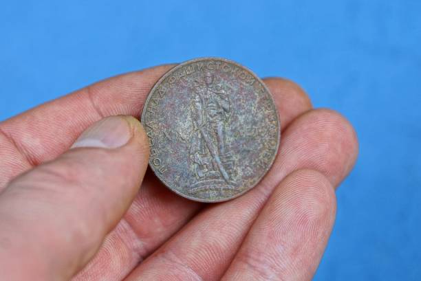 istock old gray soviet ruble coin in fingers 1164196229