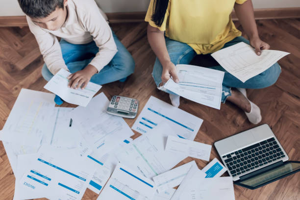 istock Mother and Son Managing the debt 1164197251