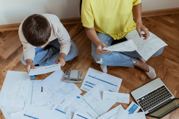 istock Mother and Son Managing the debt 1164197283