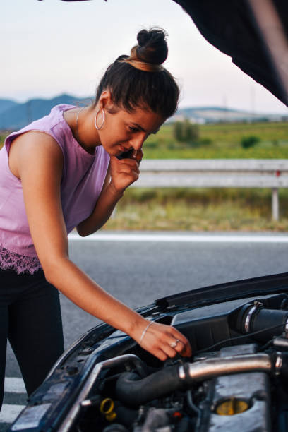 istock Woman calling car assistance 1164198245