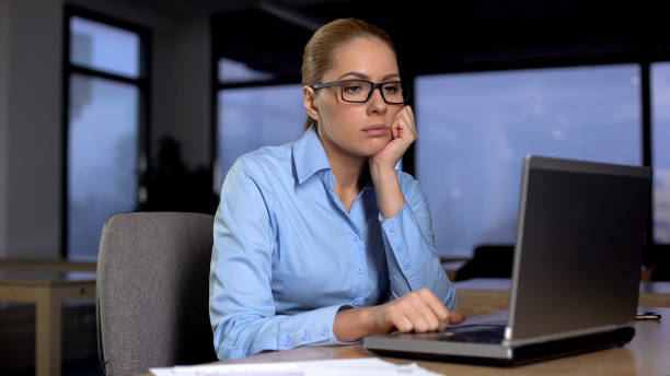 istock Tired woman thinking over business project, working extra hours, lack of ideas 1164203157