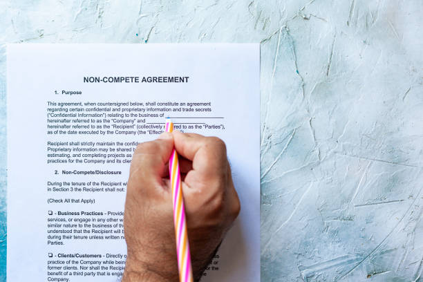 Filling Non-Compete Agreement form stock photo