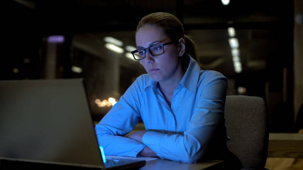 istock Woman feeling bored and exhausted in office, working overtime, low productivity 1164205103