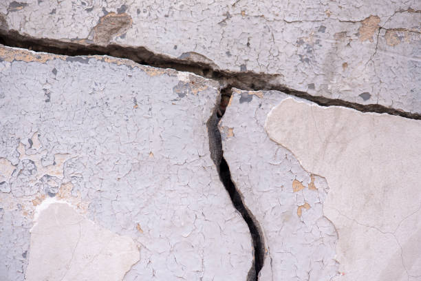 istock Old concrete Wall with deep big Crack as Background or Texture 1164206130