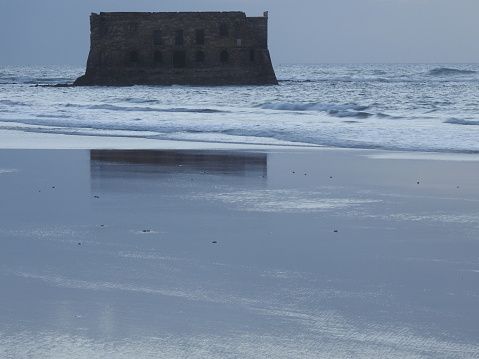 Casa Del Mar. The Atlantic ocean, the Cape Juby, Morocco. The ruined fortress, a tide, sand beach ,sea house .