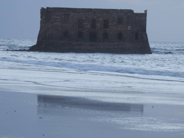 Casa Del Mar. The Atlantic ocean, the Cape Juby, Morocco. The ruined fortress, a tide, sand beach ,sea house .