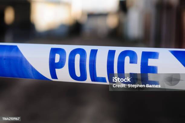 Police Cordon Tape Stock Photo - Download Image Now - Police Force, UK, Barricade Tape