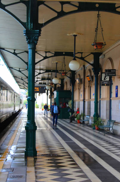 Taormina, Italy - 2nd November 2018: Passengers walking and sitting at Taormina train station