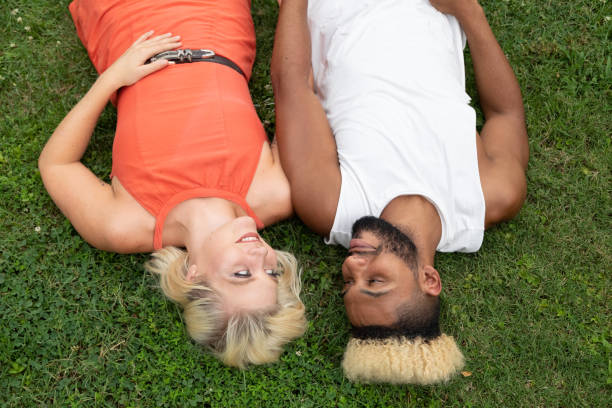 istock A couple lay in the grass 1164212931