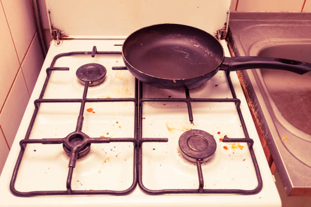 istock Dirty grubby gas stove in kitchen 1164214008