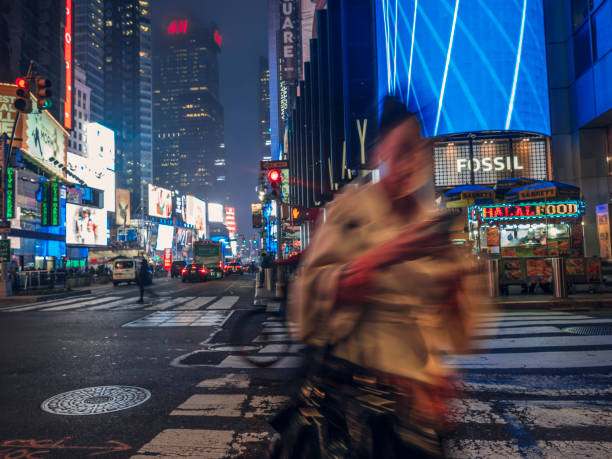 istock People On Zebra Crossing At Night 1164215224