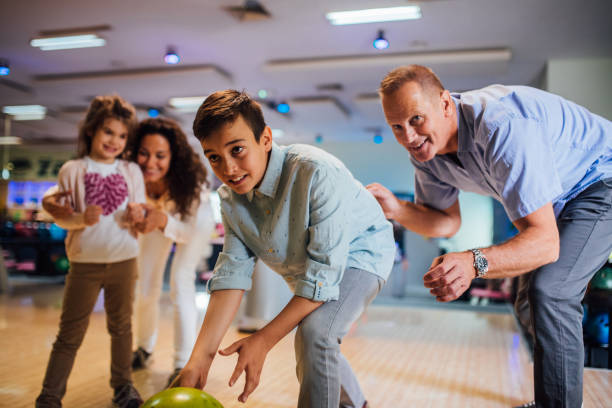 istock Family at bowling alley 1164215440