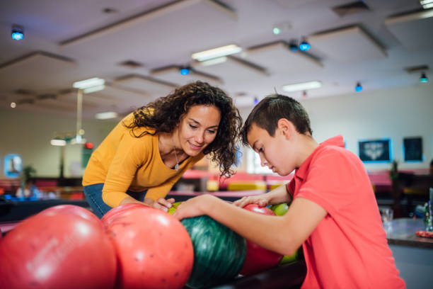 istock Mother and son at bowling alley 1164217826