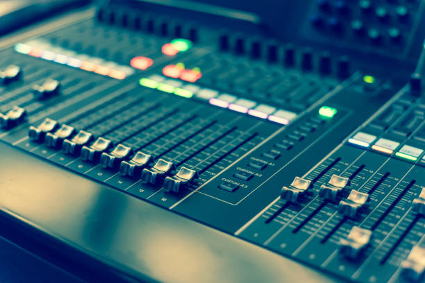 istock Filtered image colorful sound mixer control DJ turntable close-up 1164219224