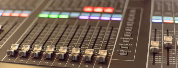 istock Panoramic view colorful sound mixer control DJ turntable close-up 1164219852