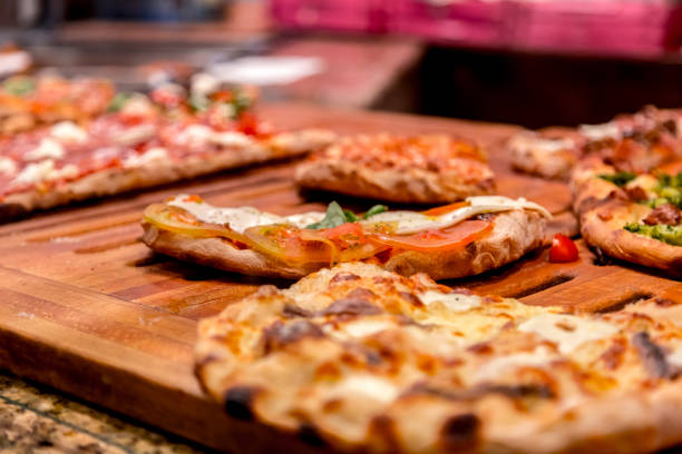 istock Authentic Italian pizza in a restaurant display window in Rome 1164221053