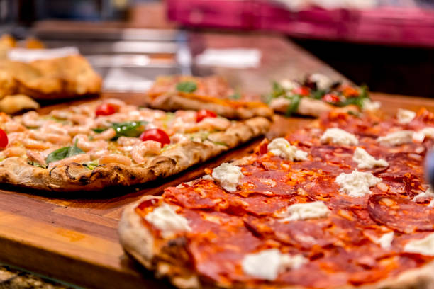 istock Authentic Italian pizza in a restaurant display window in Rome 1164221056