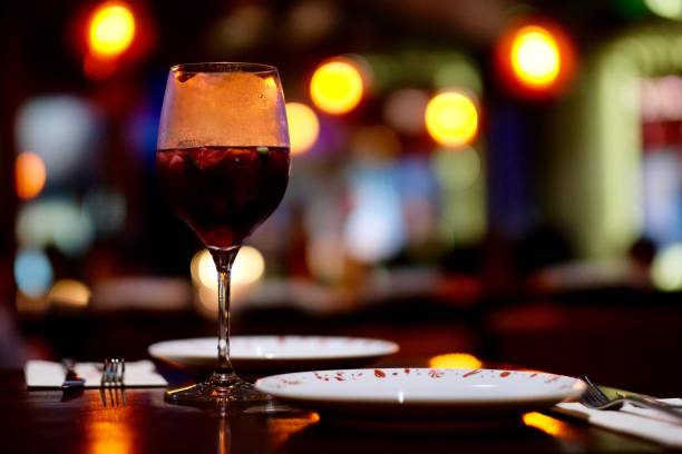 istock close up a glass of red cocktail on table. 1164223046