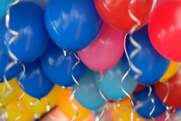 istock look up seamless colorful hydrogen balloons with silver ribbons. 1164223893