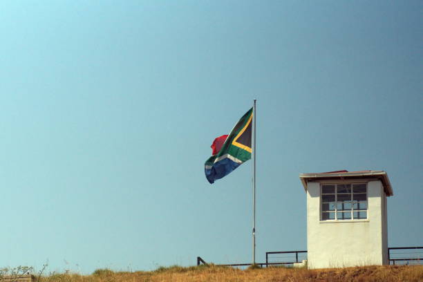 South African flag on Constitution Hill South African flag flying beside a guard post outside of the old prison museum on Constitution Hill in Johannesburg, South Africa pretoria prison stock pictures, royalty-free photos & images