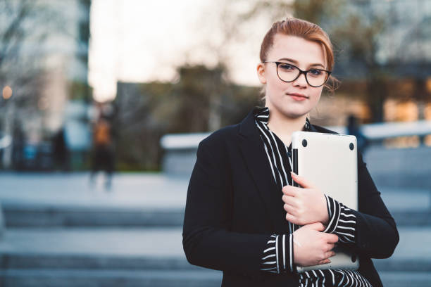 istock Young woman exchange student working as an intern in London 1164227734