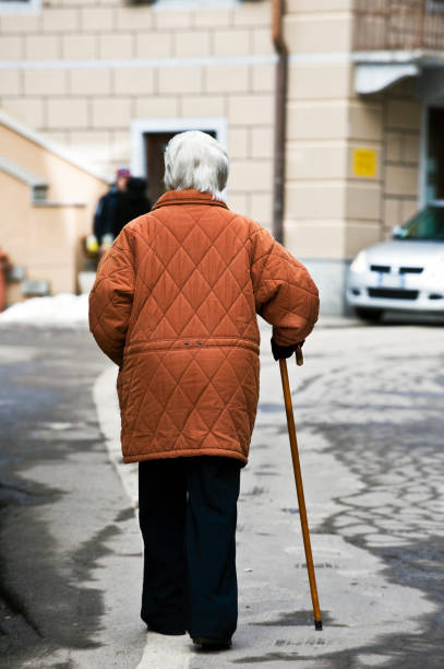 istock Senior Adult Walking with Cane. Color Image 116422810
