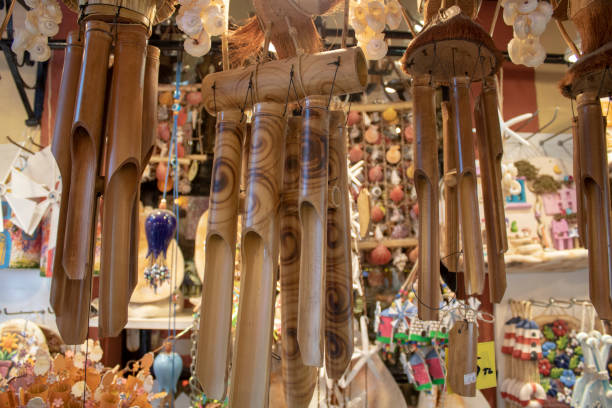 istock Hanging wooden wind bell. Close-up. Blurred background. 1164228618