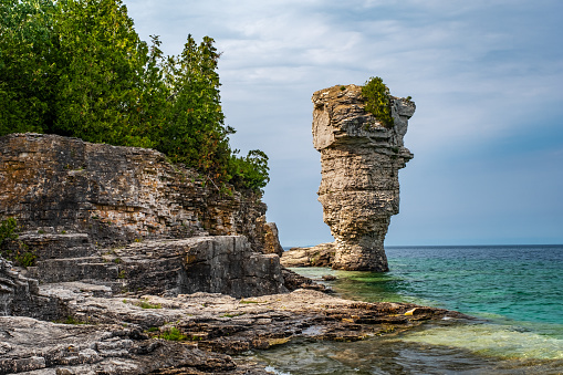 On Flowerpot island in Fathom Five National Marine Park, one of the two rock pillars or sea stacks, rise majestically from the waters of Georgian Bay.