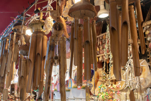 istock Hanging wooden wind bell. Close-up. Blurred background. 1164231740