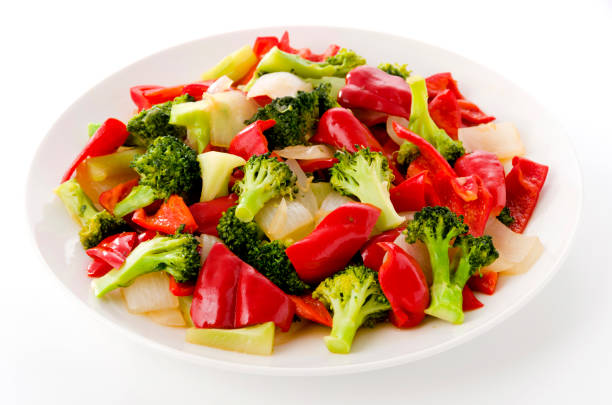 Stir fry Red Bell Pepper and broccoli onion on white plate