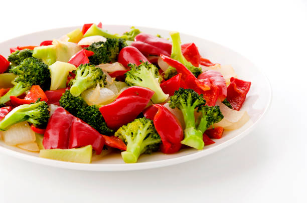 Stir fry Red Bell Pepper and broccoli onion on white plate