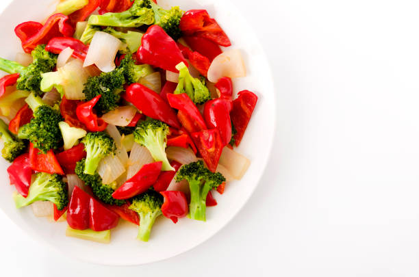 Stir fry Red Bell Pepper and broccoli onion on white plate
