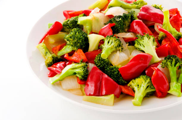 Stir fry Red Bell Pepper and broccoli onion on white plate