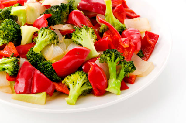 Stir fry Red Bell Pepper and broccoli onion on white plate