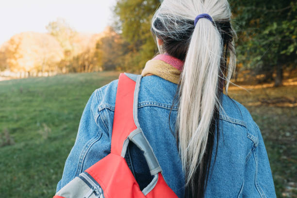 istock open air leisure lady backpack autumn nature park 1164233797
