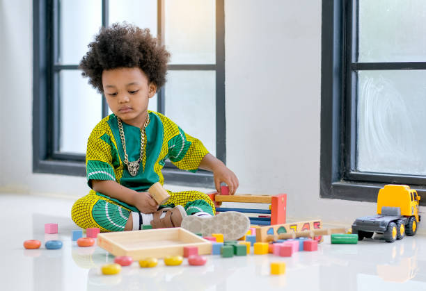 istock African young boy has fun with playing various type of toys 1164233857