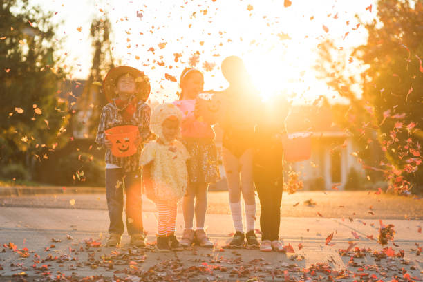 istock Multiethnic group of kids trick or treating 1164233904