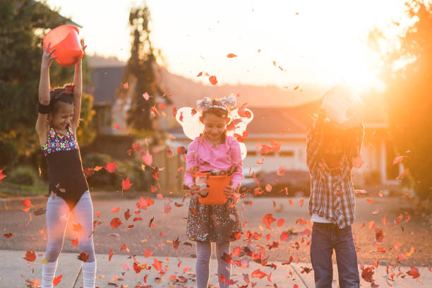 istock Multiethnic group of kids trick or treating 1164233906
