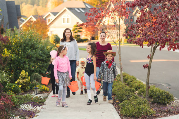 istock Multiethnic group of kids trick or treating 1164233985