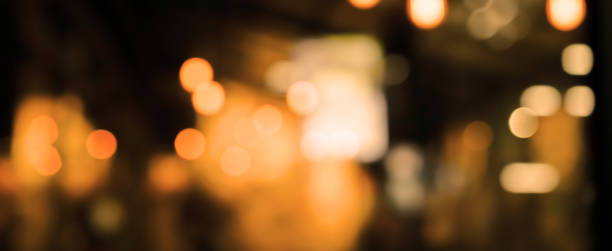 abstract blurred darkness of beautiful inside interior modern restaurant nightclub retail background for design concept