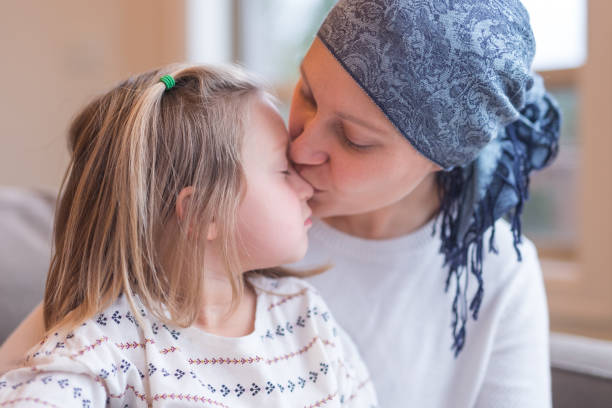 istock Young mom with cancer holds her daughter 1164234960