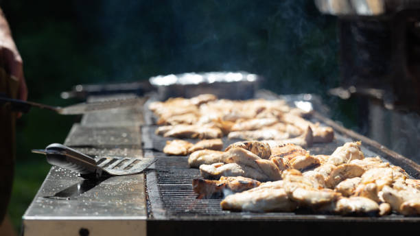 istock BBQ Chicken Cooking on Large Grill 1164241204
