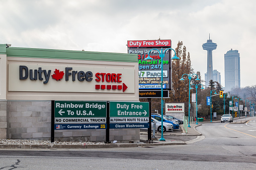 NIAGARA FALLS, CANADA - DECEMBER 3, 2017: Sign of  Rainbow bridge and Duty Free Store in Niagara Falls, Ontario, Canada