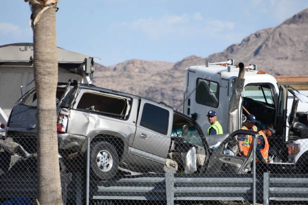 Traffic Collision between trailer truck and SUV on Las Vegas Blvd. North, adjacent to Las Vegas Speedway, North of Nellis AFB Las Vegas, Nevada / United States -  July 25, 2019: Traffic Collision between trailer truck and SUV on Las Vegas Blvd. North, adjacent to Las Vegas Speedway, North of Nellis AFB Truck and SUV were in major collision, causing road closure and major response by Nevada State Troopers.  The road was closed for several hours while Nevada State Troopers made an investigation.  This was at the intersection of Las Vegas Blvd. North and Checkered Flag Lane. military building photos stock pictures, royalty-free photos & images