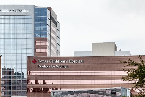 Houston, Texas, USA - September 22, 2018: Sign of Texas Children's Hospital pavilion for women on the building, a pediatric hospital located in the Texas Medical Center in Houston, Texas.
