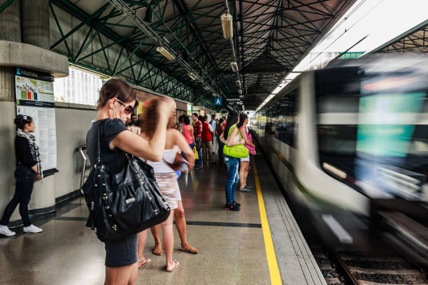 Medellin Metro Passengers waiting for the Medellin Metro, Industriales station, is a rapid transit system that crosses the Metropolitan Area of Medellín from North to South and from Centre to West metro medellin stock pictures, royalty-free photos & images