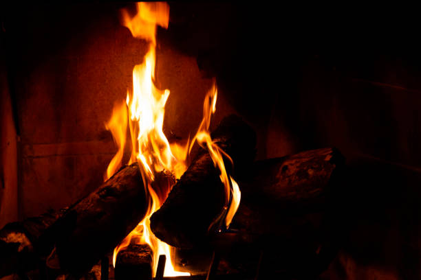 istock Fireplace detail with tall fire flames 1164243837