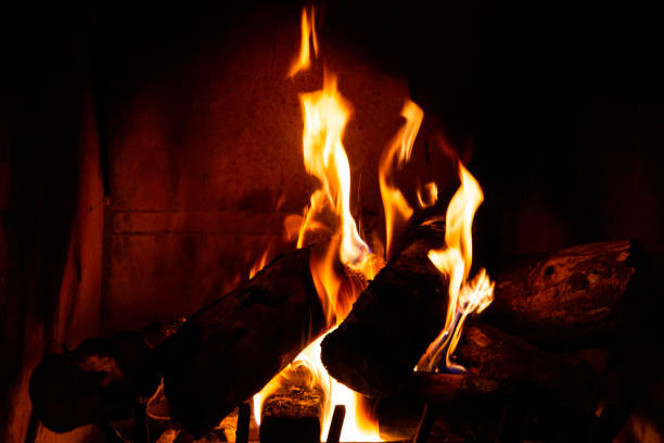 istock Fireplace detail with tall fire flames 1164243853